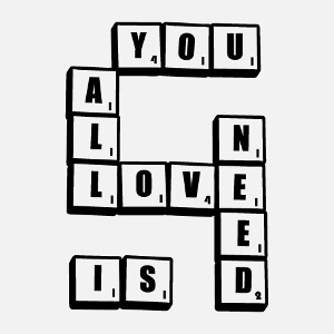 All you need is love, citation amour et chansons crite en lettres dessines sur des jetons de Scrabble.