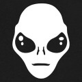 Alien doux et mignon dessiné en aplat et découpes des yeux et traits du visage.