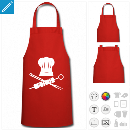 Tablier pirate compos d'une toque et de fourchette de barbecue et brochette croises.